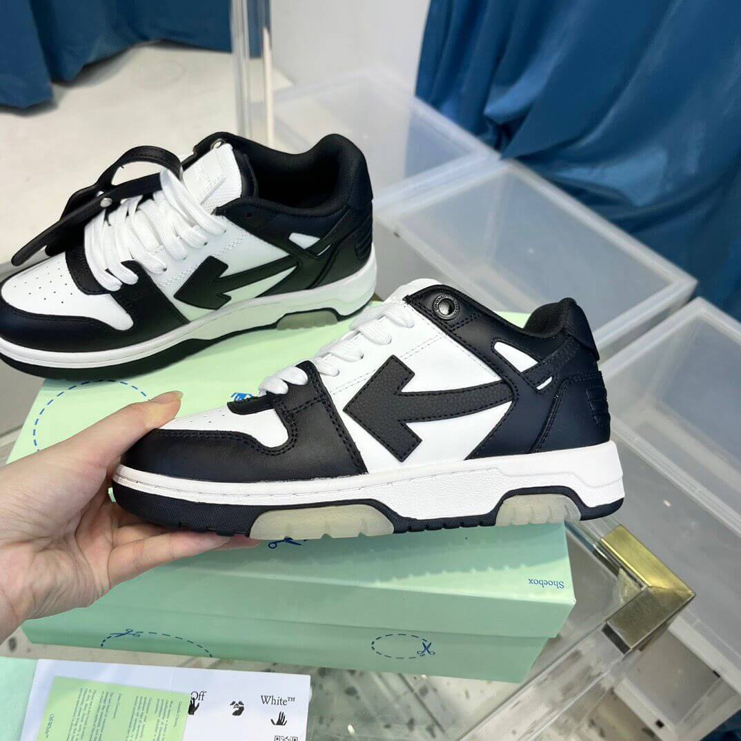 Off White sneakers featuring a black and white design with signature arrow details.