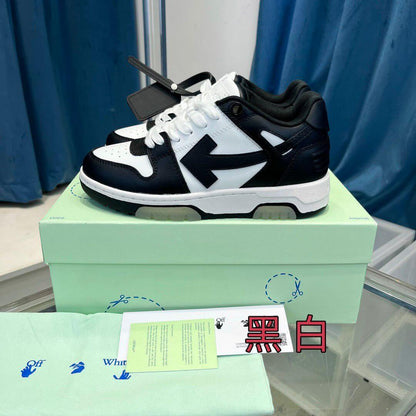 Off White sneakers displayed in a shoe box with an instruction card and green cloth.